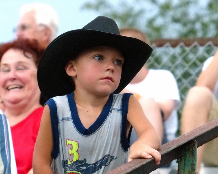 Little boy with black cowboy hat on